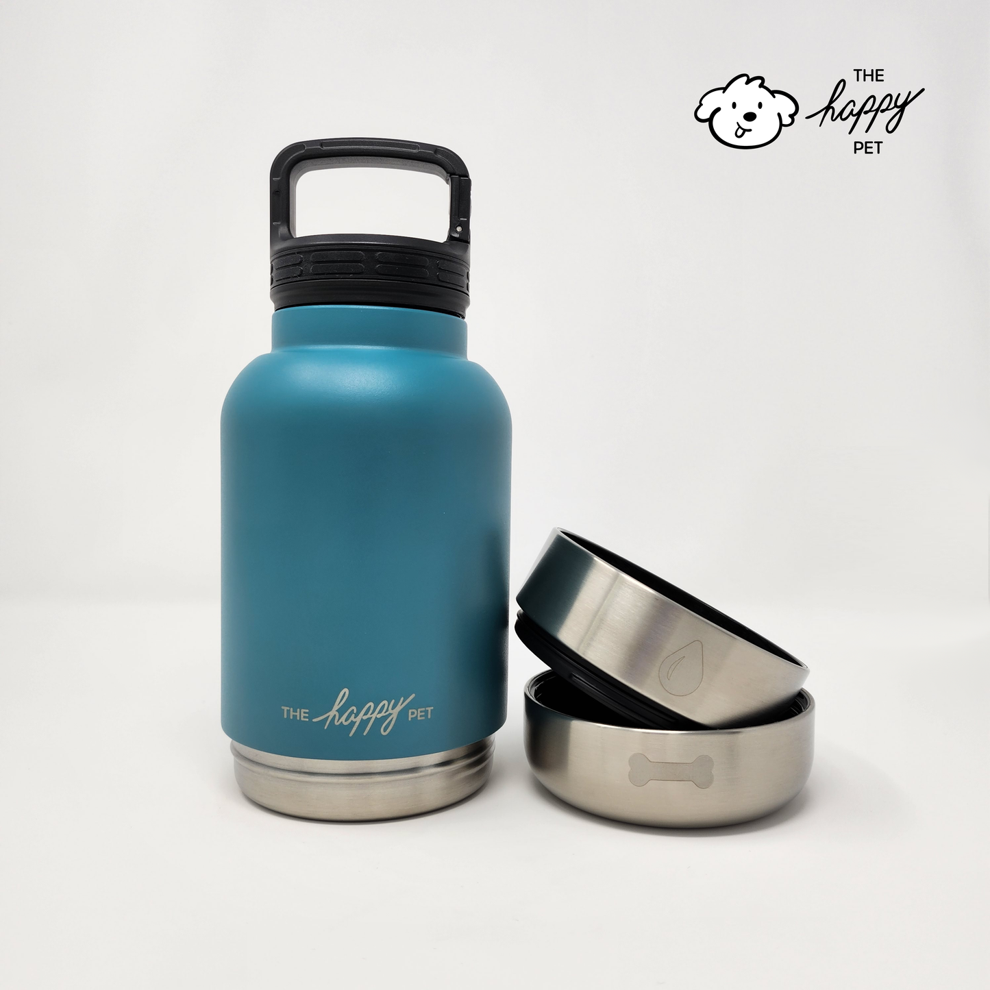 Blue insulated bottle with black lid and two metal bowls on a white background, featuring 'The Happy Pet' brand.